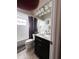 Bathroom features a shower and bath, toilet, and a hard surface sink vanity at 19059 Sw 92Nd Loop, Dunnellon, FL 34432