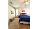 Bedroom features natural light, bench, ceiling fan, and hard flooring at 19059 Sw 92Nd Loop, Dunnellon, FL 34432