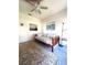 This bedroom features a ceiling fan, natural light, and a beautiful rug at 19059 Sw 92Nd Loop, Dunnellon, FL 34432