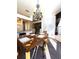 The dining room has a chandelier and lots of light coming in through the windows at 19059 Sw 92Nd Loop, Dunnellon, FL 34432