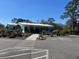 Well-maintained building featuring manicured landscaping, ample parking and attractive architectural details at 19059 Sw 92Nd Loop, Dunnellon, FL 34432