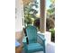Comfortable front porch with a chair, perfect for relaxing and enjoying the outdoor views at 19059 Sw 92Nd Loop, Dunnellon, FL 34432