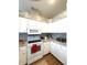 This bright kitchen has white cabinets, hard surface countertops, and a tile backsplash at 19059 Sw 92Nd Loop, Dunnellon, FL 34432
