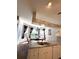 Bright kitchen overlooks dining area, with white cabinetry and plenty of counter space at 19059 Sw 92Nd Loop, Dunnellon, FL 34432