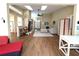 Open floor plan connects the living room and office with hardwood floors and bright lighting at 19059 Sw 92Nd Loop, Dunnellon, FL 34432