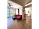 Comfortable living room featuring wood flooring and a modern sofa at 19059 Sw 92Nd Loop, Dunnellon, FL 34432