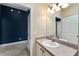 Well-lit bathroom with modern fixtures, vanity, and an adjoining room for added convenience at 2693 Craven Way, The Villages, FL 32162