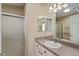 Bathroom featuring a shower/tub combo with white vanity and a large mirror at 2693 Craven Way, The Villages, FL 32162