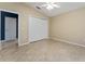 Cozy bedroom with double closet, light tile flooring, and adjoining rooms offering a peaceful retreat at 2693 Craven Way, The Villages, FL 32162