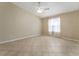 Bright bedroom with ceiling fan, tile floors, and large window at 2693 Craven Way, The Villages, FL 32162