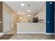 Kitchen area with bar and neutral walls at 2693 Craven Way, The Villages, FL 32162