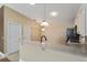 Kitchen area with bar and tile floors at 2693 Craven Way, The Villages, FL 32162