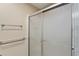 Shower with glass doors, a towel rack, and a safety bar at 2693 Craven Way, The Villages, FL 32162
