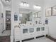 Bright bathroom with double vanity, vessel sinks, and tile flooring with an open layout at 2780 Ne 127Th Pl, Anthony, FL 32617
