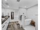 Bathroom featuring a modern soaking tub, a dual-sink vanity, and a walk-in shower at 2780 Ne 127Th Pl, Anthony, FL 32617