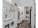 Bright bathroom featuring double vanities with vessel sinks, and modern fixtures at 2780 Ne 127Th Pl, Anthony, FL 32617