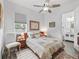 Cozy bedroom featuring a comfortable bed, soft lighting, and a tranquil view of the outdoors at 2780 Ne 127Th Pl, Anthony, FL 32617