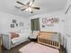 Charming Bedroom with a crib, daybed, and decor at 2780 Ne 127Th Pl, Anthony, FL 32617
