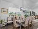 Well-lit dining area showcasing a large window with a view of the outdoor landscape at 2780 Ne 127Th Pl, Anthony, FL 32617