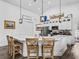 Modern kitchen featuring a breakfast bar with seating and sleek white countertops at 2780 Ne 127Th Pl, Anthony, FL 32617
