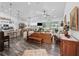 Spacious open-concept living room with hardwood floors and abundant natural light at 2780 Ne 127Th Pl, Anthony, FL 32617
