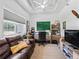 Office featuring a large window, a leather sofa, and a ceiling fan at 2780 Ne 127Th Pl, Anthony, FL 32617