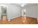 Brightly lit bedroom featuring hardwood floors and easy access to the kitchen and an additional room at 3230 Se 45Th St, Ocala, FL 34480