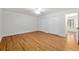 Bedroom featuring hardwood floors, ample closet space, and a ceiling fan for climate control at 3230 Se 45Th St, Ocala, FL 34480