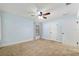 Comfortable bedroom features light blue walls, neutral carpet, and a window for natural light at 3230 Se 45Th St, Ocala, FL 34480