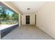 Side entrance to covered parking area with door to interior at 3230 Se 45Th St, Ocala, FL 34480