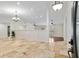Open-concept foyer with tile flooring, high ceilings, and modern lighting at 3230 Se 45Th St, Ocala, FL 34480