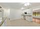 Spacious kitchen with granite countertops, white cabinetry and tiled floors for seamless transition at 3230 Se 45Th St, Ocala, FL 34480