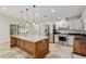 Updated kitchen with granite island, stainless steel appliances, recessed lighting, and ample storage at 3230 Se 45Th St, Ocala, FL 34480