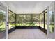 Screened-in lanai with tile flooring offers a relaxing view of the fenced-in backyard at 3230 Se 45Th St, Ocala, FL 34480