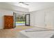 Main bedroom featuring direct access to backyard pool through French doors at 3230 Se 45Th St, Ocala, FL 34480