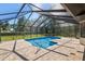 Bright screened-in pool with ample brick pavers for lounging at 3230 Se 45Th St, Ocala, FL 34480