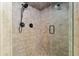 Tiled shower with dual shower heads, a hand-held, and seamless glass doors at 3230 Se 45Th St, Ocala, FL 34480