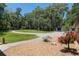 Expansive, lush yard featuring mature trees and detailed landscaping at 3230 Se 45Th St, Ocala, FL 34480