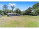 Expansive backyard with lush green grass, providing ample space for outdoor activities and recreation at 3810 Sw 5Th Ave, Ocala, FL 34471