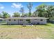 A large backyard and patio provide ample space for outdoor activities at 3810 Sw 5Th Ave, Ocala, FL 34471