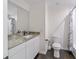 Bathroom featuring granite countertop vanity, mirror, and toilet at 3810 Sw 5Th Ave, Ocala, FL 34471