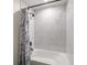 Updated bathroom featuring a shower over tub with stylish tile and modern fixtures at 3810 Sw 5Th Ave, Ocala, FL 34471