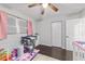 Bright bedroom with a ceiling fan, and a pink color scheme, and ample natural light at 3810 Sw 5Th Ave, Ocala, FL 34471