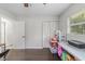 A clean, minimalistic bedroom features built-in closets and a bright window at 3810 Sw 5Th Ave, Ocala, FL 34471
