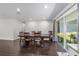 Dining room with natural light and sliding door access to the backyard, seamlessly blending indoor and outdoor spaces at 3810 Sw 5Th Ave, Ocala, FL 34471