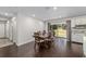 Dining room featuring dark wood floors, sliding glass doors to the backyard, and modern lighting at 3810 Sw 5Th Ave, Ocala, FL 34471