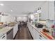 Bright kitchen featuring granite countertops, white cabinets, and stainless steel appliances at 3810 Sw 5Th Ave, Ocala, FL 34471