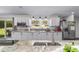 Bright kitchen with stainless steel appliances, granite countertops, and modern fixtures at 3810 Sw 5Th Ave, Ocala, FL 34471