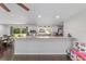A modern kitchen and open breakfast bar makes it a perfect space for cooking and entertaining at 3810 Sw 5Th Ave, Ocala, FL 34471