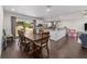 Open concept living and dining area with hardwood floors, and open to the kitchen at 3810 Sw 5Th Ave, Ocala, FL 34471